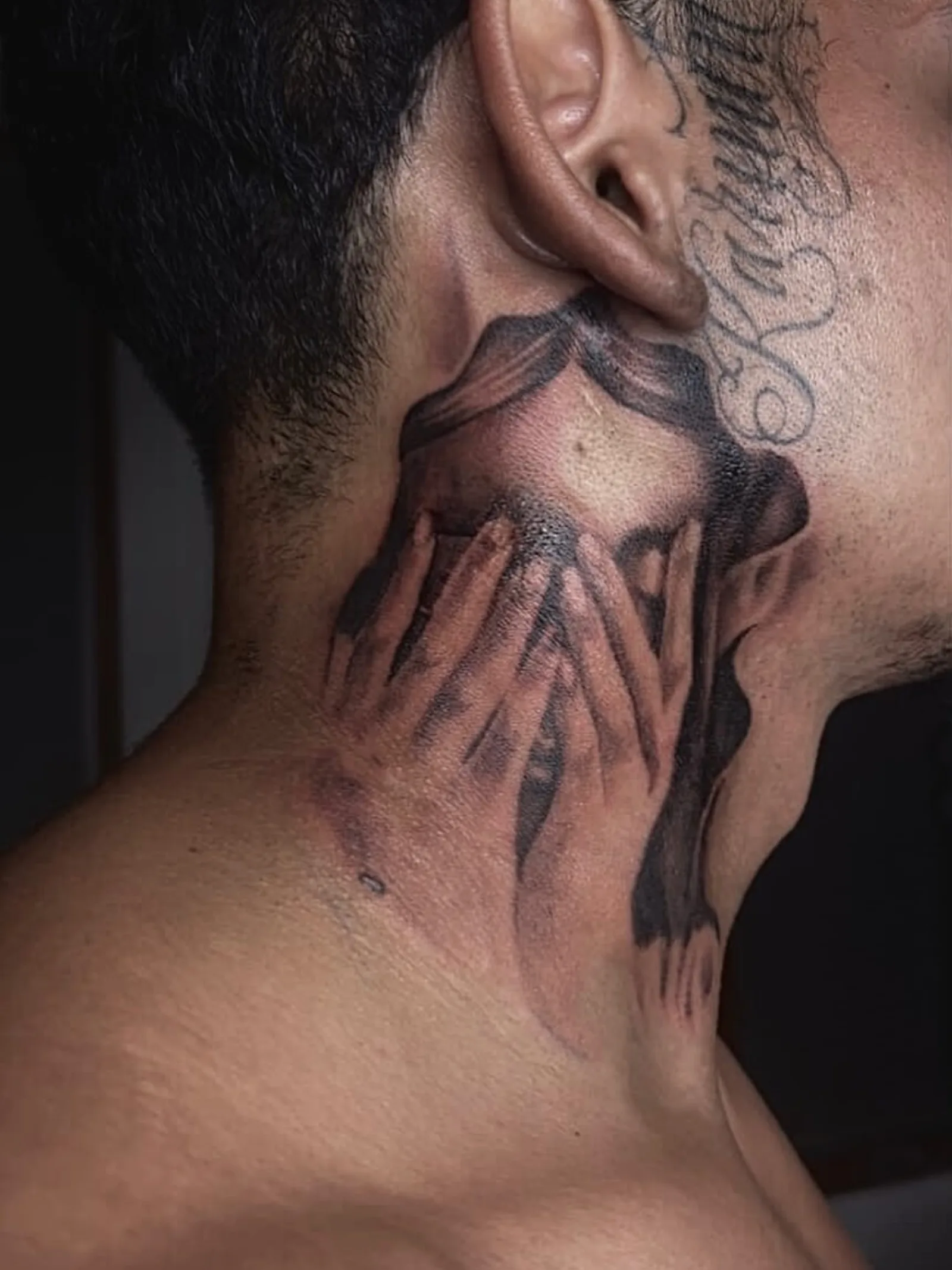 Black and grey neck tattoo of veiled hands covering a face by Creative Tat at Shadow Studio Charlotte