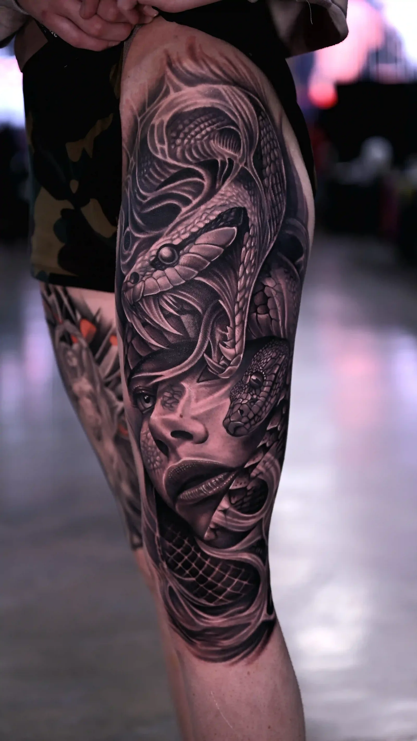 Black and grey realism half-leg sleeve of a Medusa figure with snake hair by Danyi at Shadow Studio Charlotte