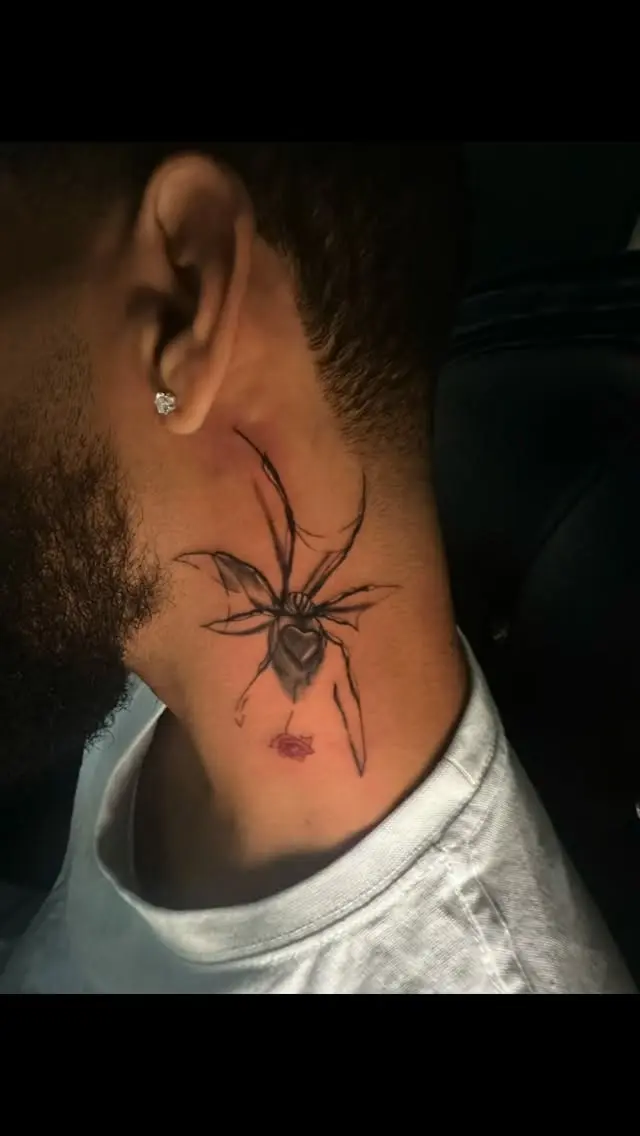 Black and grey spider tattoo on the side of the neck by Gynmo at Shadow Studio Charlotte
