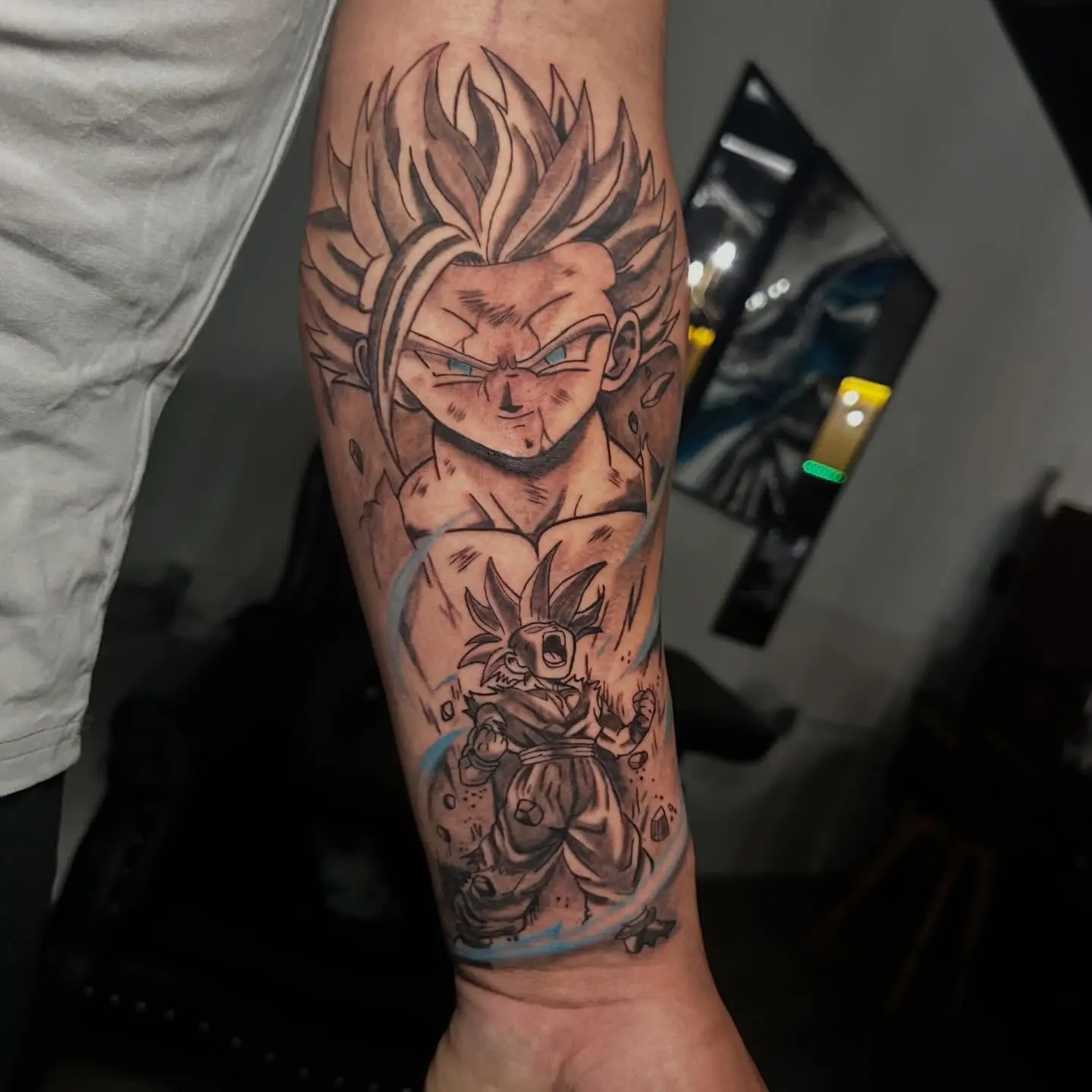 Black and grey Dragon Ball Z anime forearm tattoo of Gohan by Gynmo at Shadow Studio Charlotte